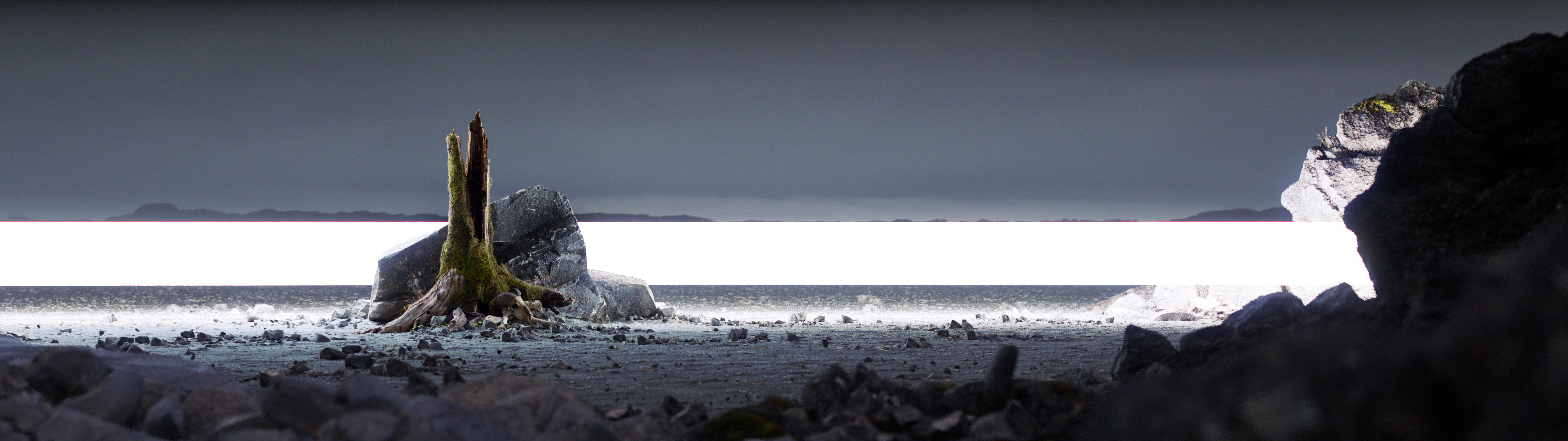 A dull rocky landscape that could have been boring if it wasn't for an unidentified band of powerful light that was crossing the landscape.