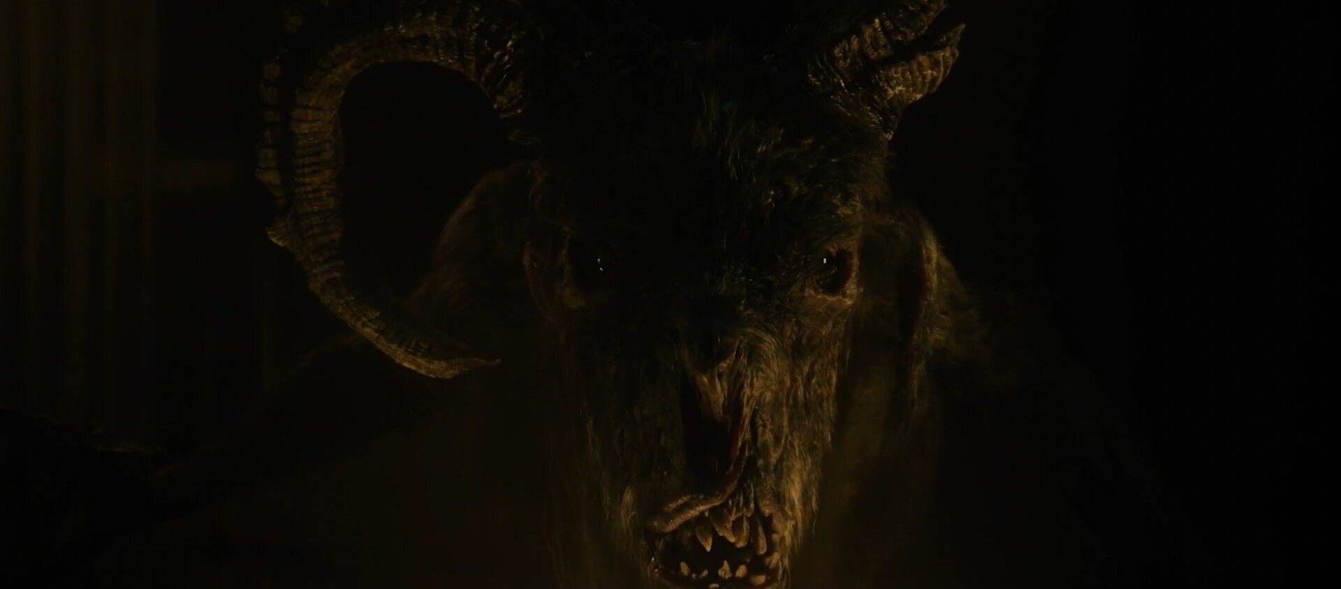 The creature is centimeters aways from your face, the darkness barely reveal an horrific goat looking monster that stare at you with malefic eyes
